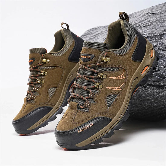 Brown suede and mesh hiking sneakers with rugged soles and lace-up closure, outdoor style