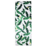 White suede travel mat with green tropical leaf print, rectangular shape