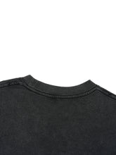 Close-up of a black shirt collar on a white background