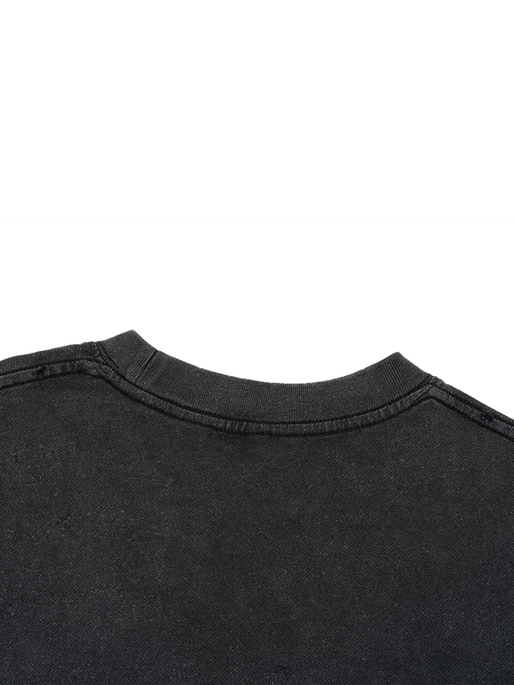 Close-up of a black shirt collar on a white background