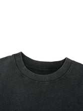 Close-up of a black sweatshirt collar on a white background