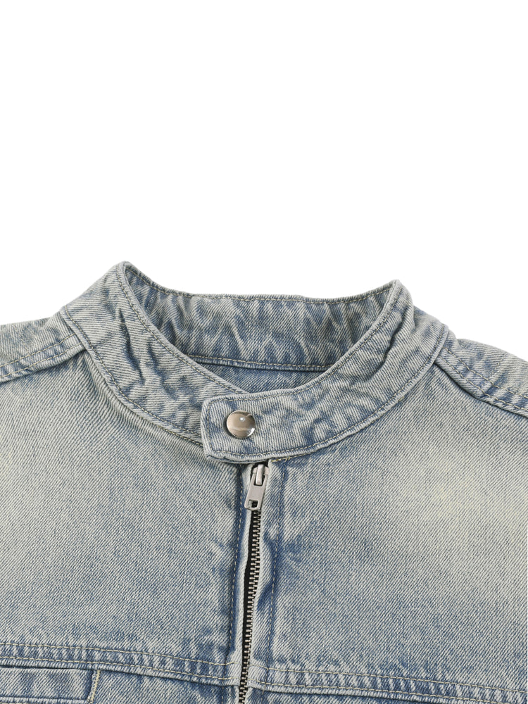 Close-up of a denim jacket collar with zipper on a white background