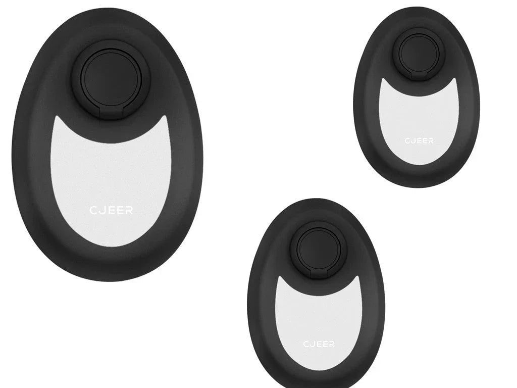 Set of three black and white oval tech accessories with sleek, modern design on white background