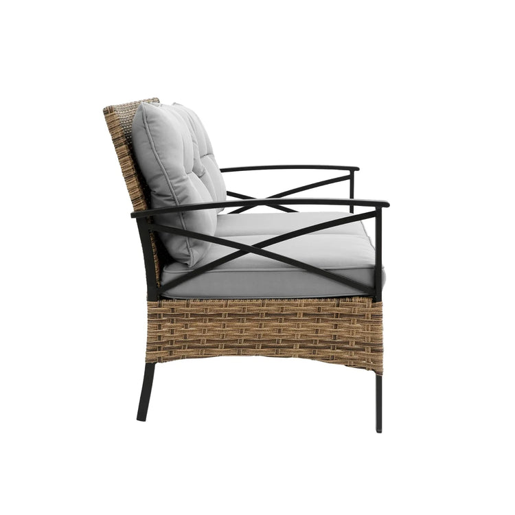 Modern outdoor chair with woven rattan frame, black metal arms, and thick gray cushions.