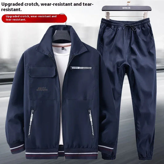 Navy blue windbreaker jacket and drawstring pants set, lightweight, relaxed fit, sporty style.