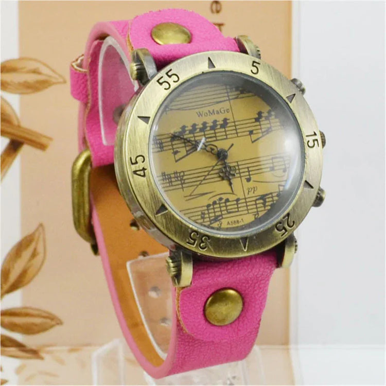 Retro watch with bronze case, yellow music note dial, and pink leather strap