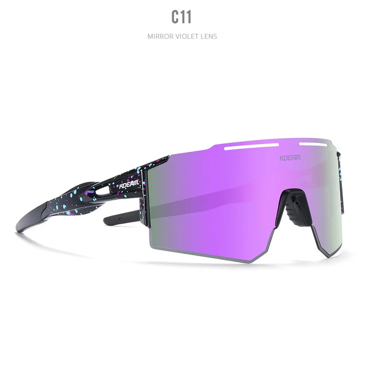 Futuristic streetwear sunglasses with mirror violet lens and black frames with blue and purple splatter pattern.
