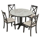 Round marble-top dining table with dark wooden base and four upholstered chairs