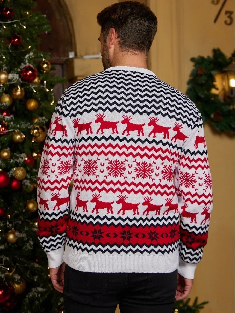 Man wearing a red, white, and black knit sweater with reindeer and snowflake holiday pattern, relaxed fit.
