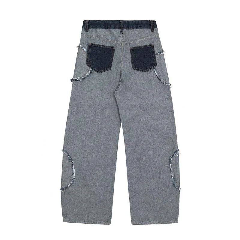 Wide-leg grey denim jeans with raw-edge dark pockets and distressed seam details