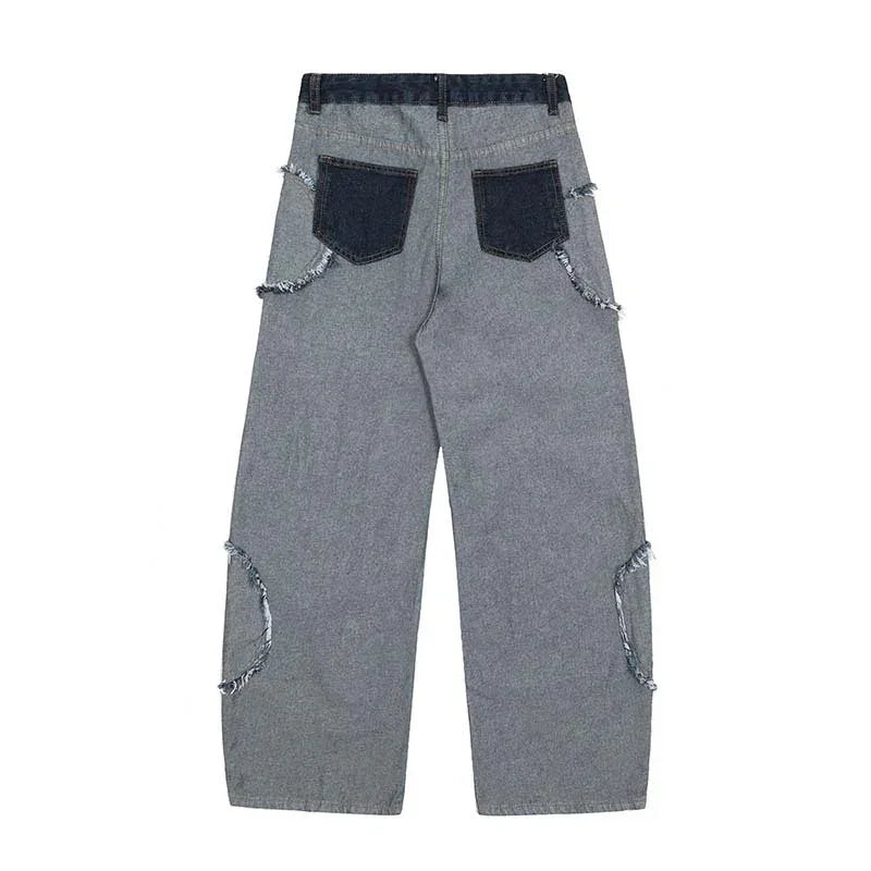 Wide-leg grey denim jeans with raw-edge dark pockets and distressed seam details