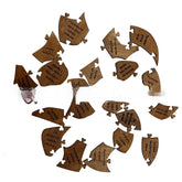 Scattered wooden puzzle pieces with engraved text, brown finish, lifestyle accessory