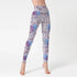 High-waisted fitted leggings with blue and purple mandala pattern on white fabric
