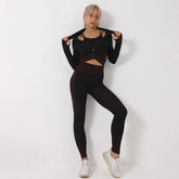 Woman in black fitted athleisure set with high-waisted leggings and zip-up crop jacket