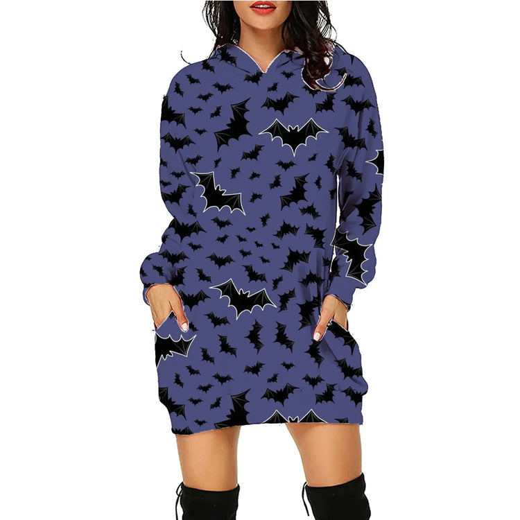 Woman wearing a loose-fit purple hoodie dress with black bat print and long sleeves