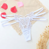 White lace butterfly thong with strappy sides, delicate floral detailing, and sheer material