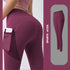 High-waisted burgundy leggings with phone pocket, stretchy athletic fit, and smooth finish.