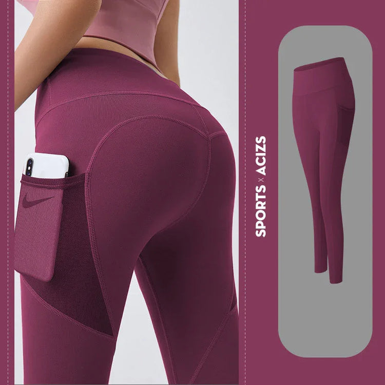 High-waisted burgundy leggings with phone pocket, stretchy athletic fit, and smooth finish.