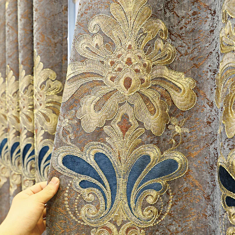 Close-up of gold and blue baroque embroidered velvet curtain with ornate pattern