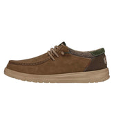 Brown suede casual shoe with lace-up design, low-top fit, and textured fabric accents