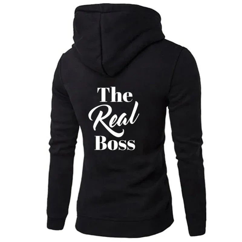 Black hooded sweatshirt with 'The Real Boss' white text on back, slim fit streetwear style