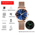 Rose gold mesh band watch with blue face, luminous hands, waterproof, slim design