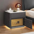 Modern bedside table with marble top, gray body, built-in gold safe, and LED lighting