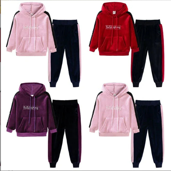 Velour tracksuit sets in pink, red, and purple with hoodies and jogger pants, color-block design.