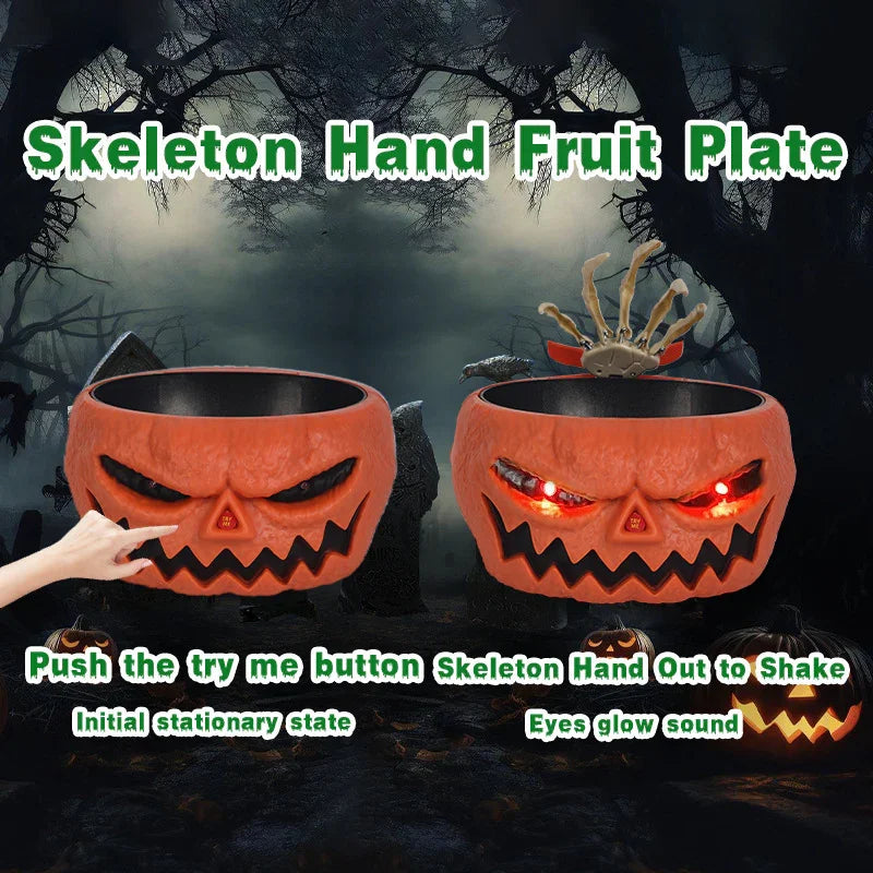 Halloween pumpkin fruit bowl with moving skeleton hand, orange plastic, glowing LED eyes.