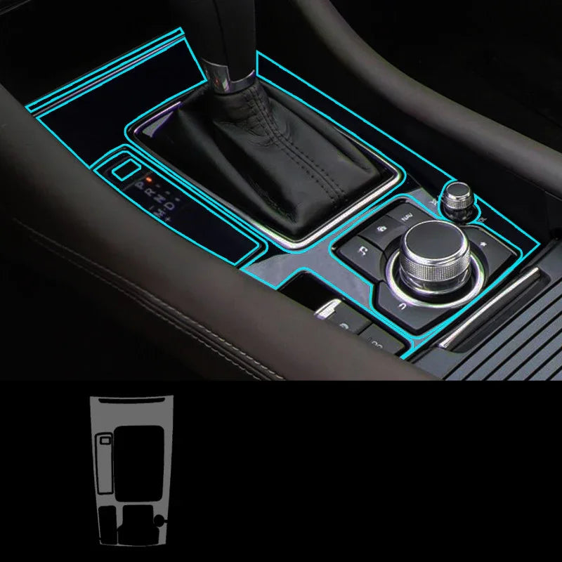 Car center console with neon blue trim accents and sleek black leather gear shift.