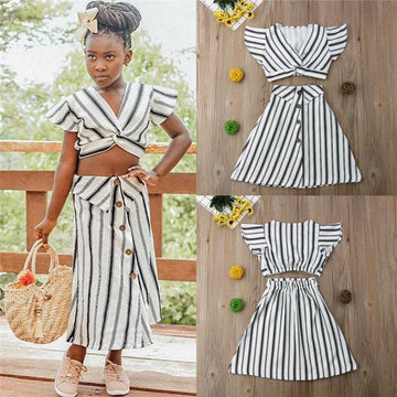 Girl in a black and white striped two-piece outfit with flutter sleeves and button-front skirt.