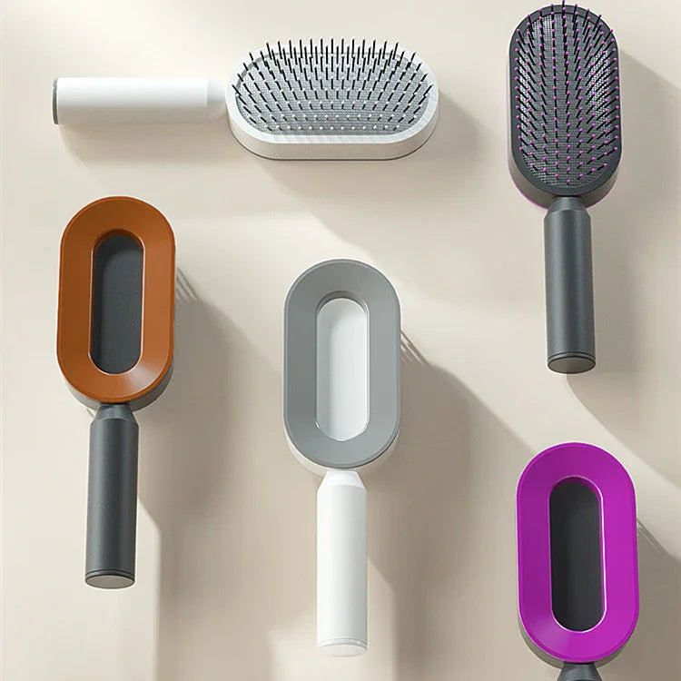 Assorted rectangular paddle hair brushes in brown, gray, purple and white with ergonomic handles