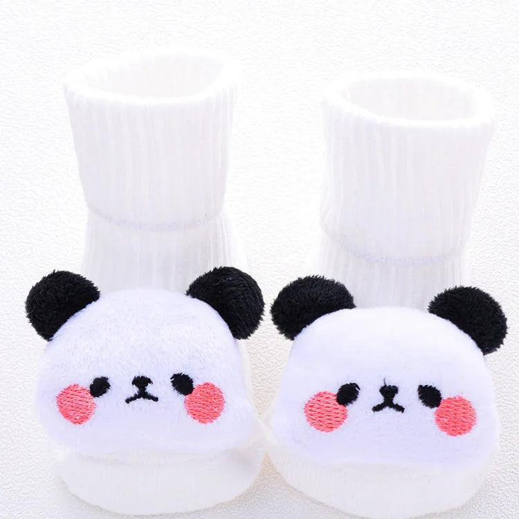 White plush baby socks with cute panda bear faces, soft material, cozy fit