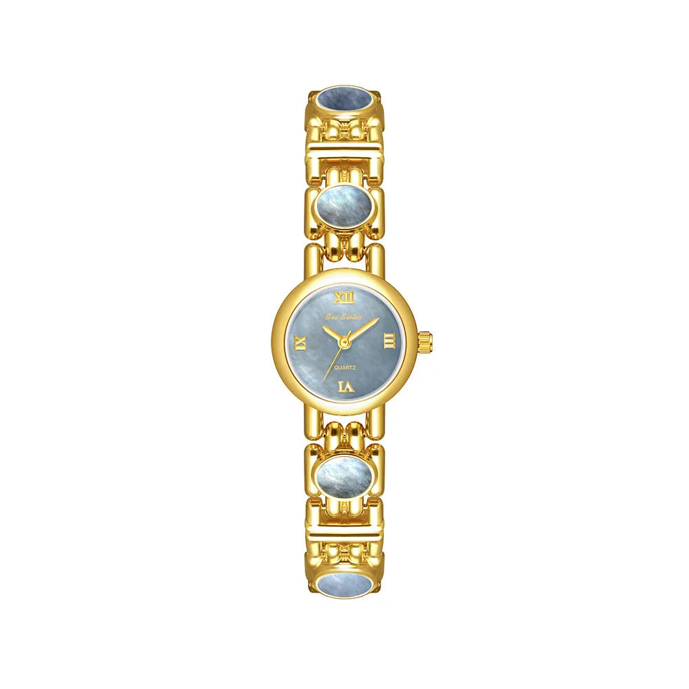 Elegant gold wristwatch with blue marble face and matching blue gemstone links, classic fit