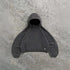 Oversized dark grey hoodie with kangaroo pocket and relaxed fit on concrete background