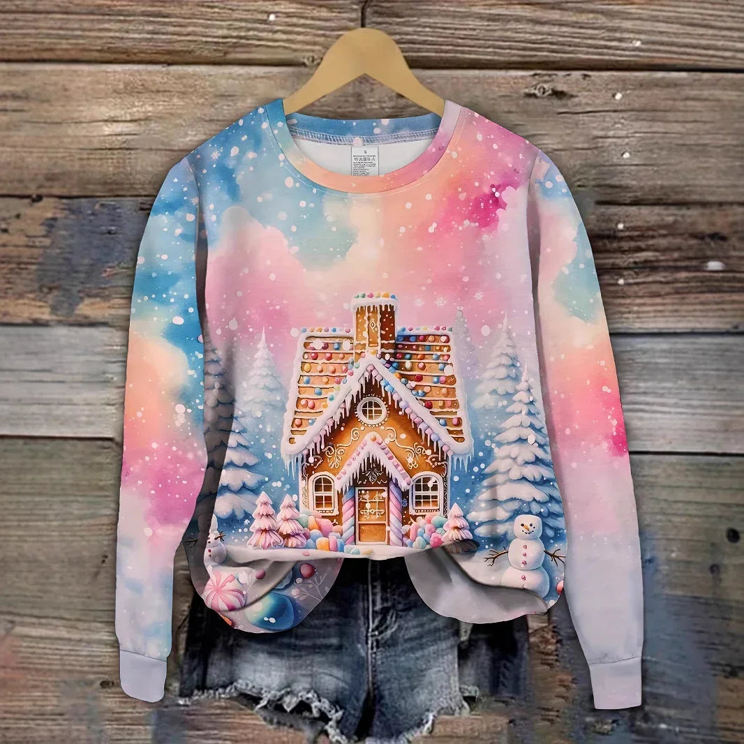 Colorful long sleeve sweatshirt with gingerbread house and winter scene print, relaxed fit.