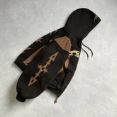 Brown and black streetwear hoodie with graphic patterns, relaxed fit, cotton blend fabric