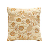 Cream and beige floral embroidered throw pillow with soft textured fabric and square shape