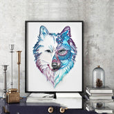 Framed wall art of a wolf with intricate, colorful geometric patterns and floral accents, displayed on a modern tabletop.