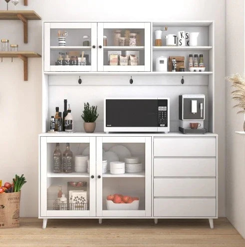 Modern white kitchen cabinet with glass doors, open shelving, and minimalist decor.
