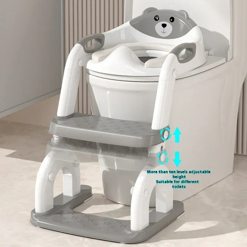 Adjustable gray and white toddler toilet training seat with step ladder and bear design