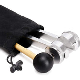Silver metal tuning forks and wooden mallet in black drawstring pouch on white background