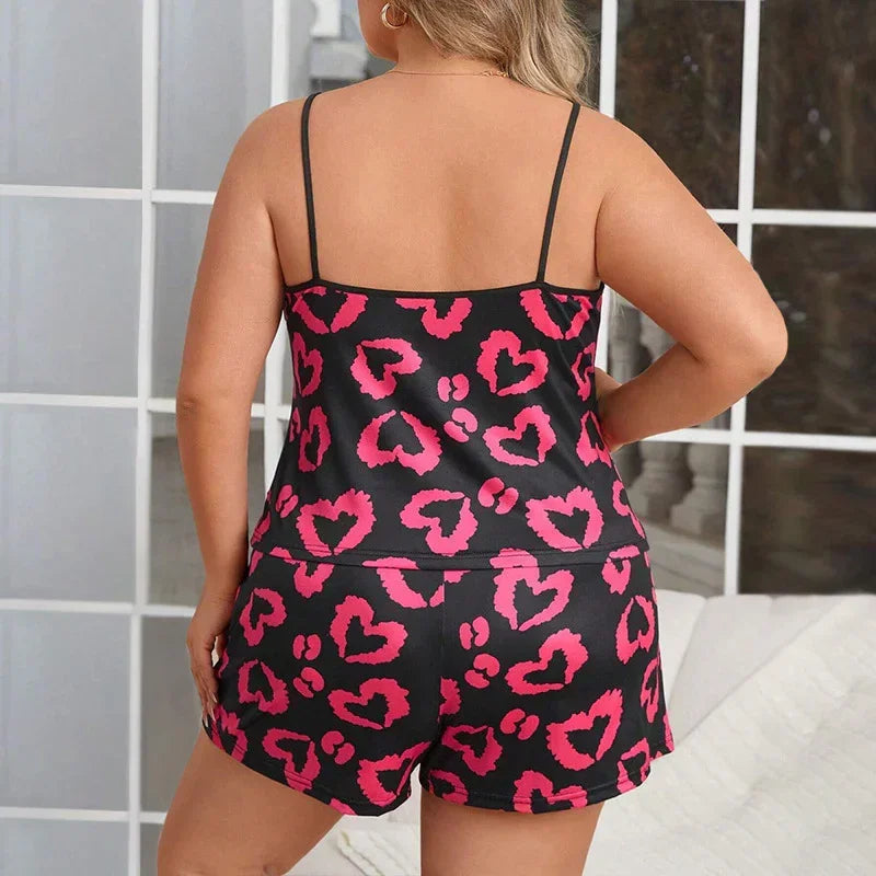 Black satin two-piece sleepwear set with pink heart leopard print, relaxed fit