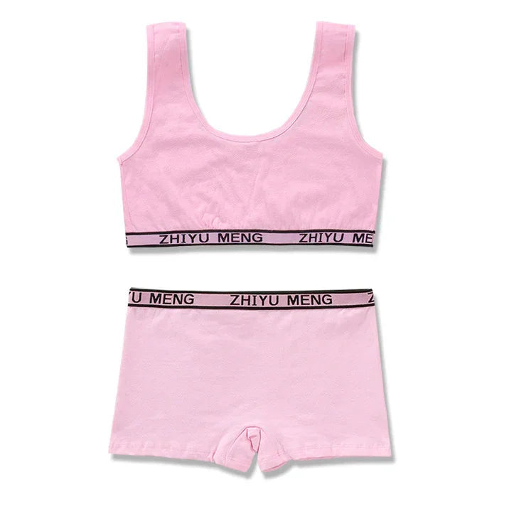 Light pink cotton bralette and shorts set with black elastic waistband and relaxed fit