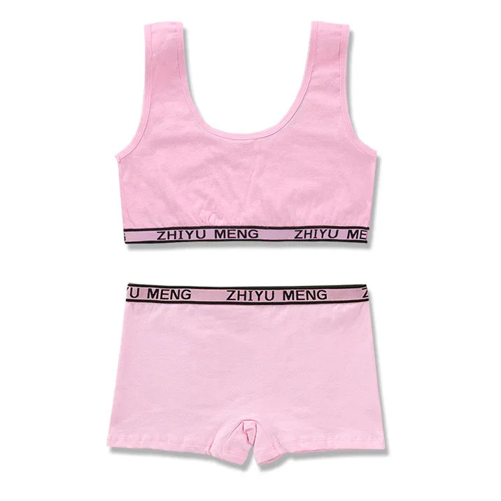 Light pink cotton bralette and shorts set with black elastic waistband and relaxed fit