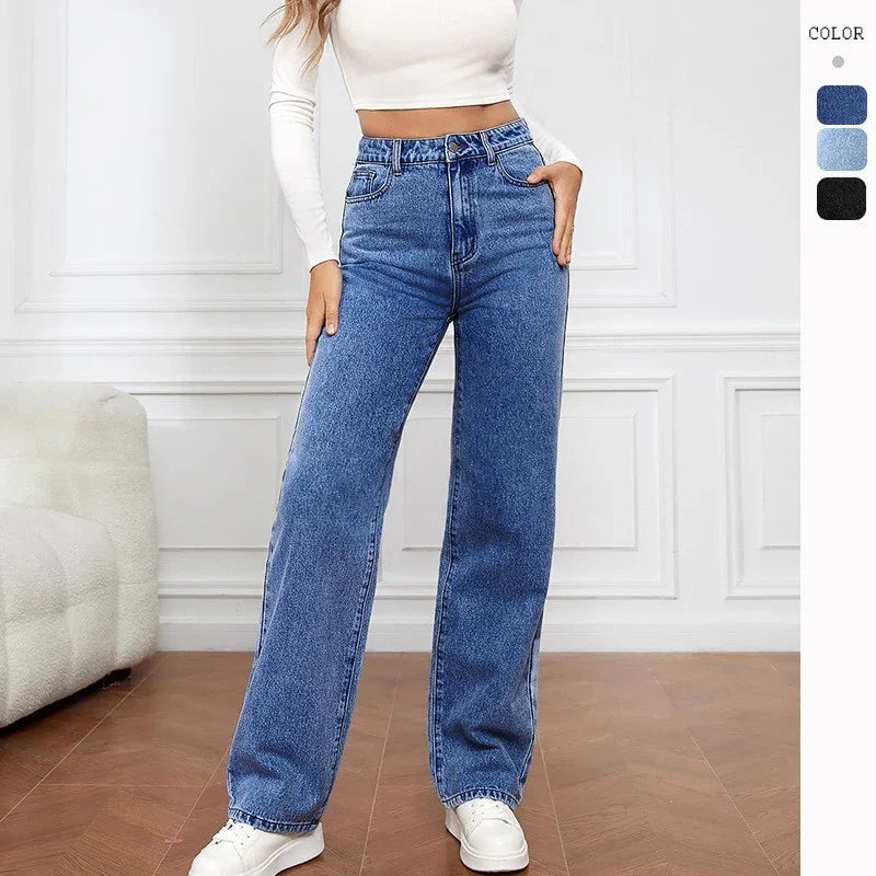 Woman wearing high-waisted blue wide-leg jeans, relaxed fit, paired with white crop top.
