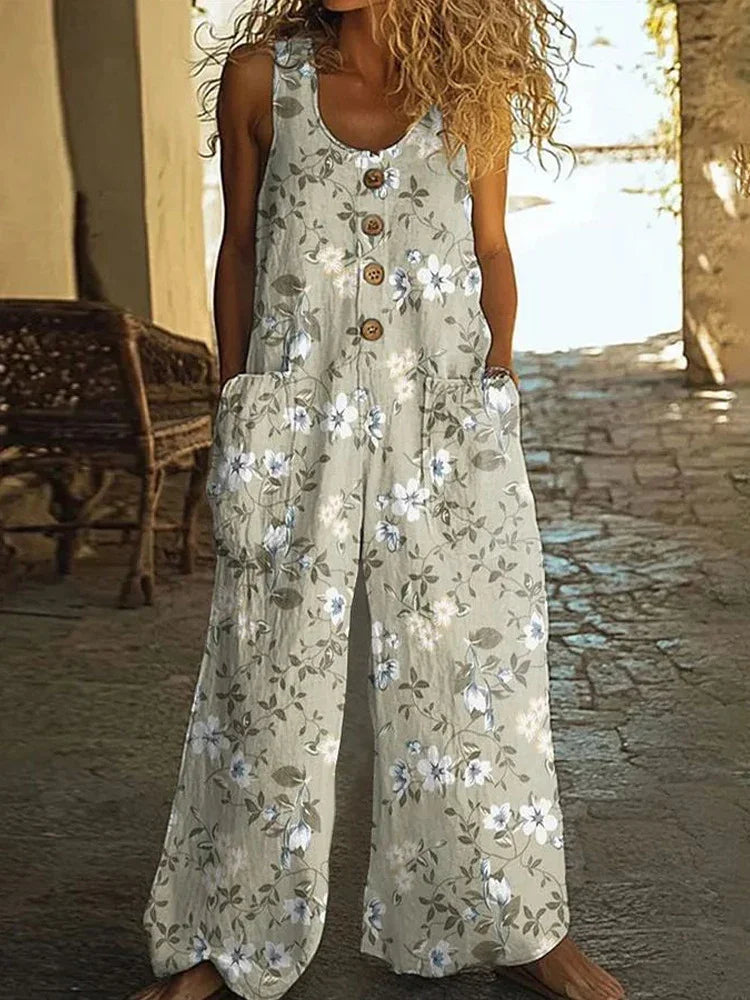 Sleeveless wide-leg beige floral jumpsuit with button front and relaxed fit, casual style