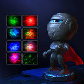 Futuristic robot figure with metallic suit, red cape, and glowing helmet, displayed with colorful LED light effects.