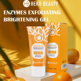 Orange tube of exfoliating brightening gel with matching box and citrus fruit on yellow background.