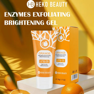 Orange tube of exfoliating brightening gel with matching box and citrus fruit on yellow background.